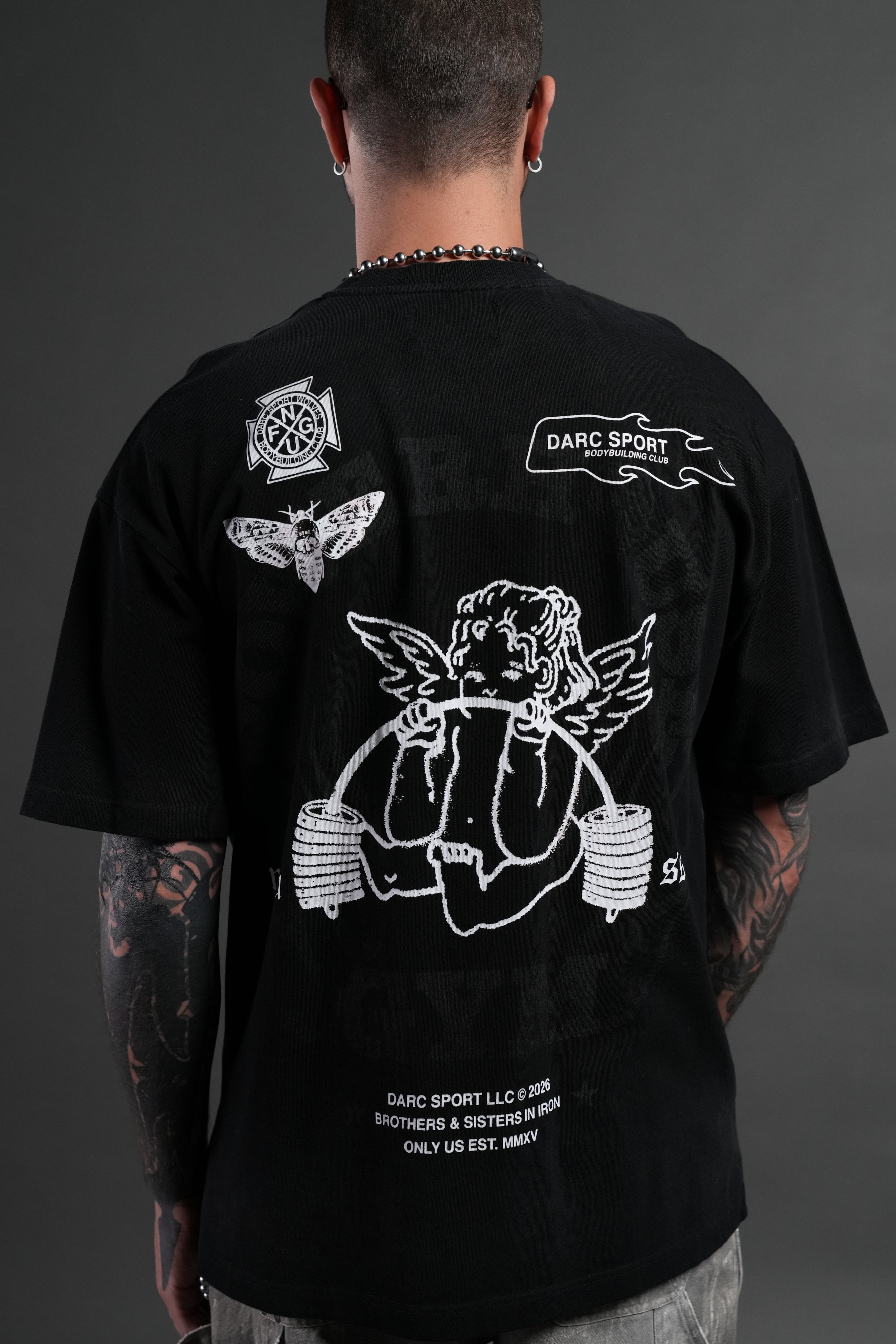 Powerhouse of the Cherub Unisex Premium Oversized Tee in Black Drift Wash — imagem 8