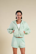 Cursive Wolves "Sage" Cropped Zip Hoodie in Honeydew Sun Fade — imagem principal