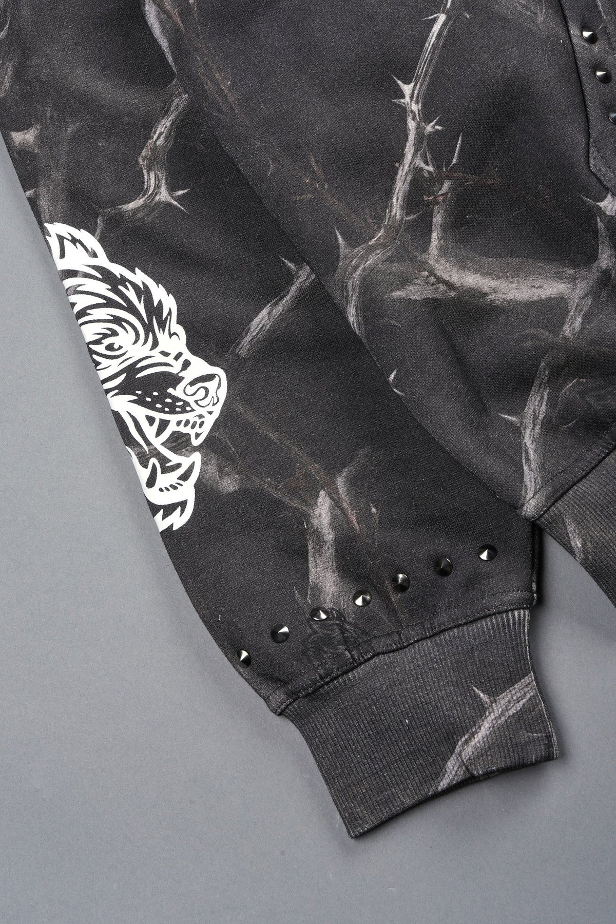 Studded Mantra Pierce Hoodie In Darc Thorns