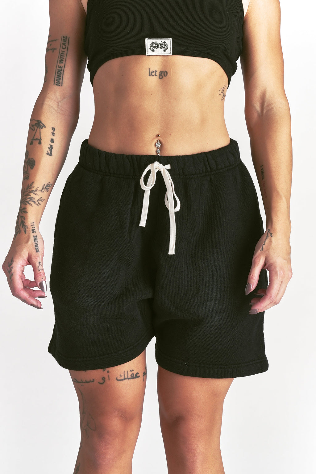 IYKYK Patched Oversized Sweat Short in Black Sun Fade — imagem principal